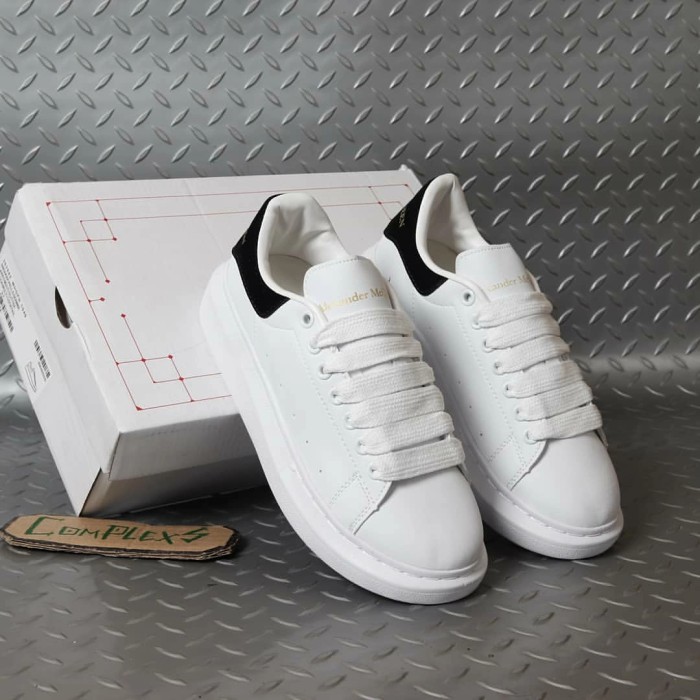 white designer plimsolls