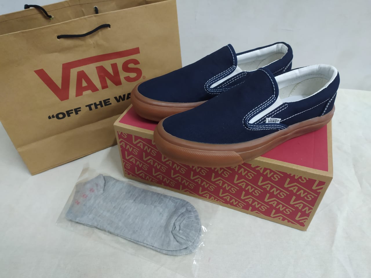 navy vans slip ons