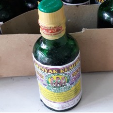 Minyak kemiri cap 3 anak