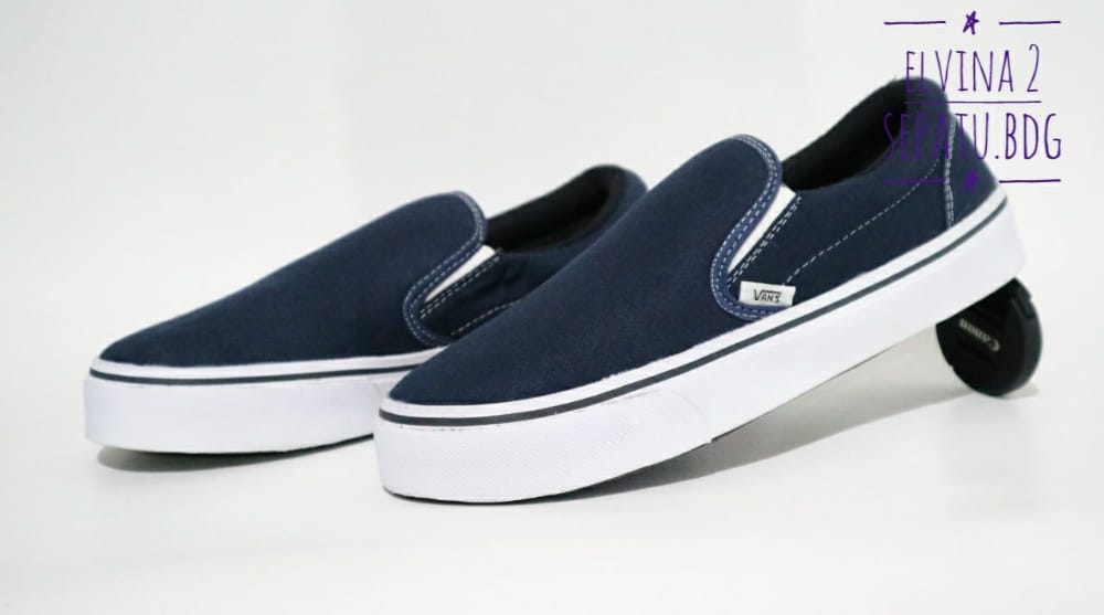 navy vans slip ons