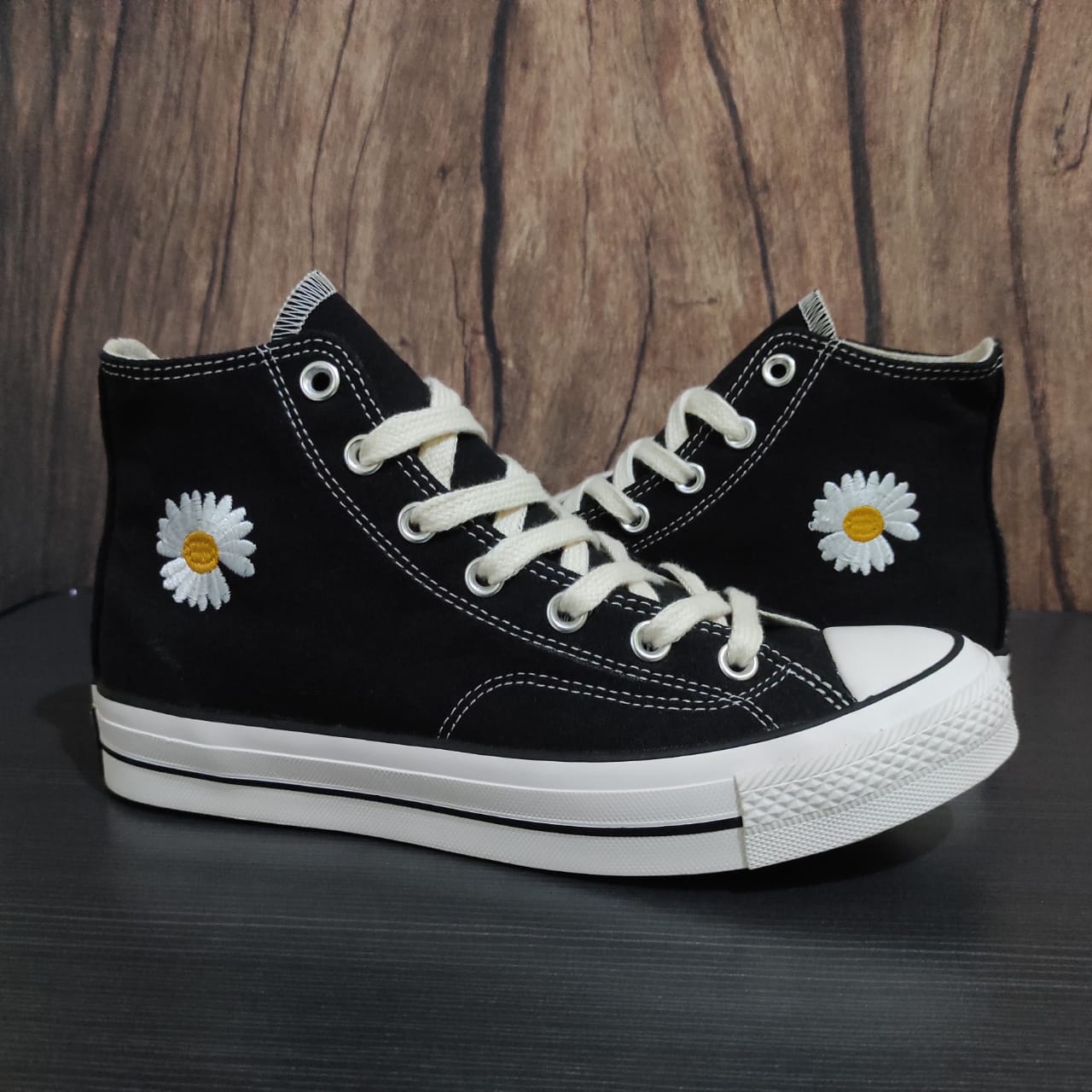 black converse with sunflowers