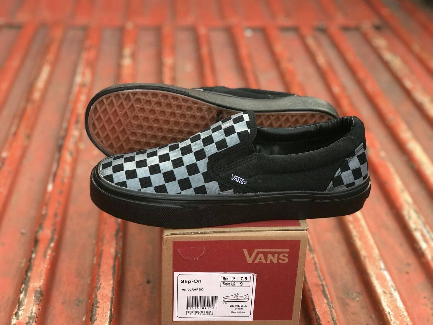 gray and black checkered slip on vans