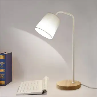 white and wood desk lamp