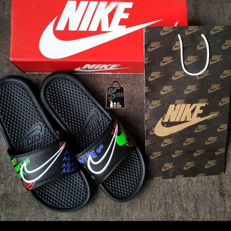 Nike benassi slides swoosh planet of hoops hot sale