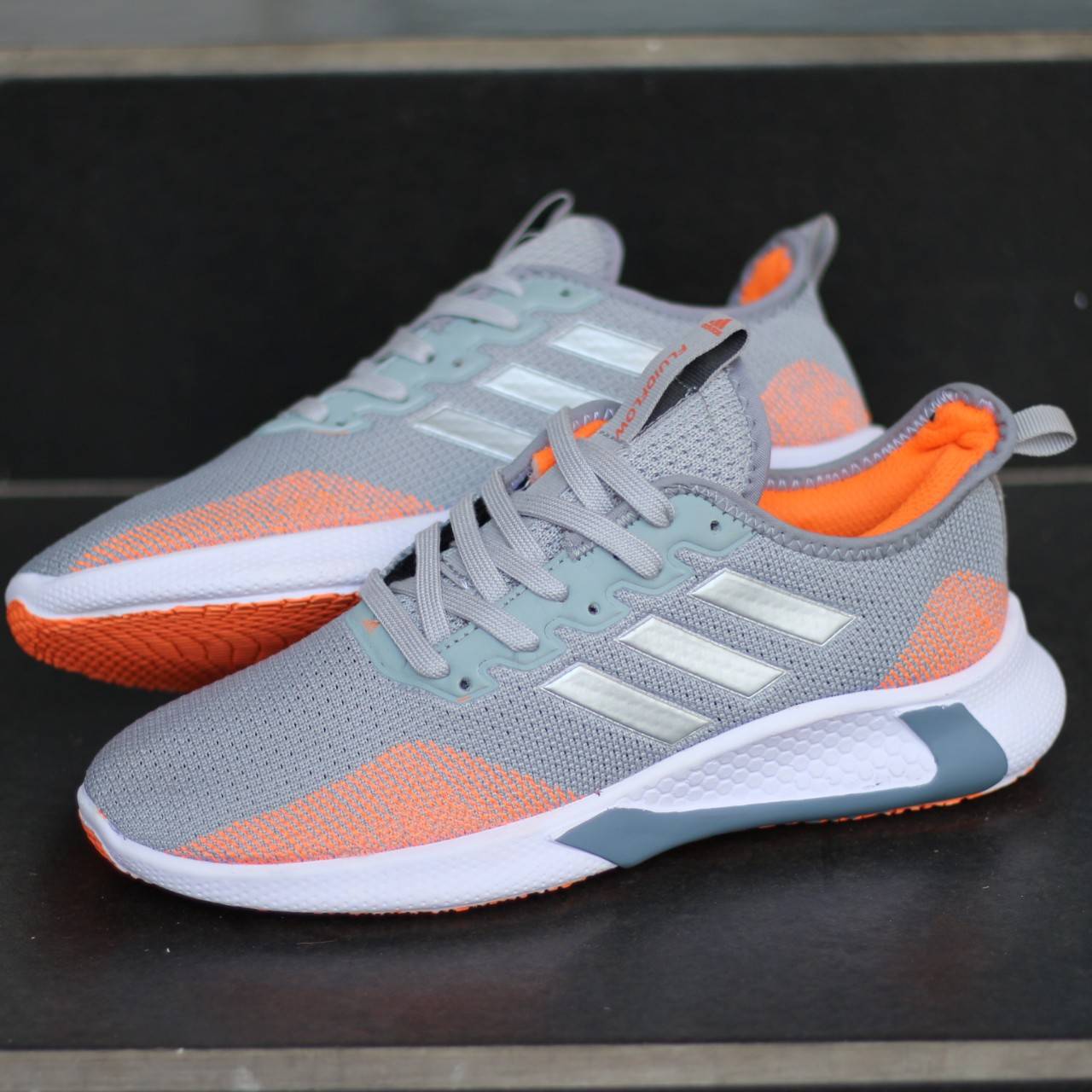 gray and orange adidas shoes
