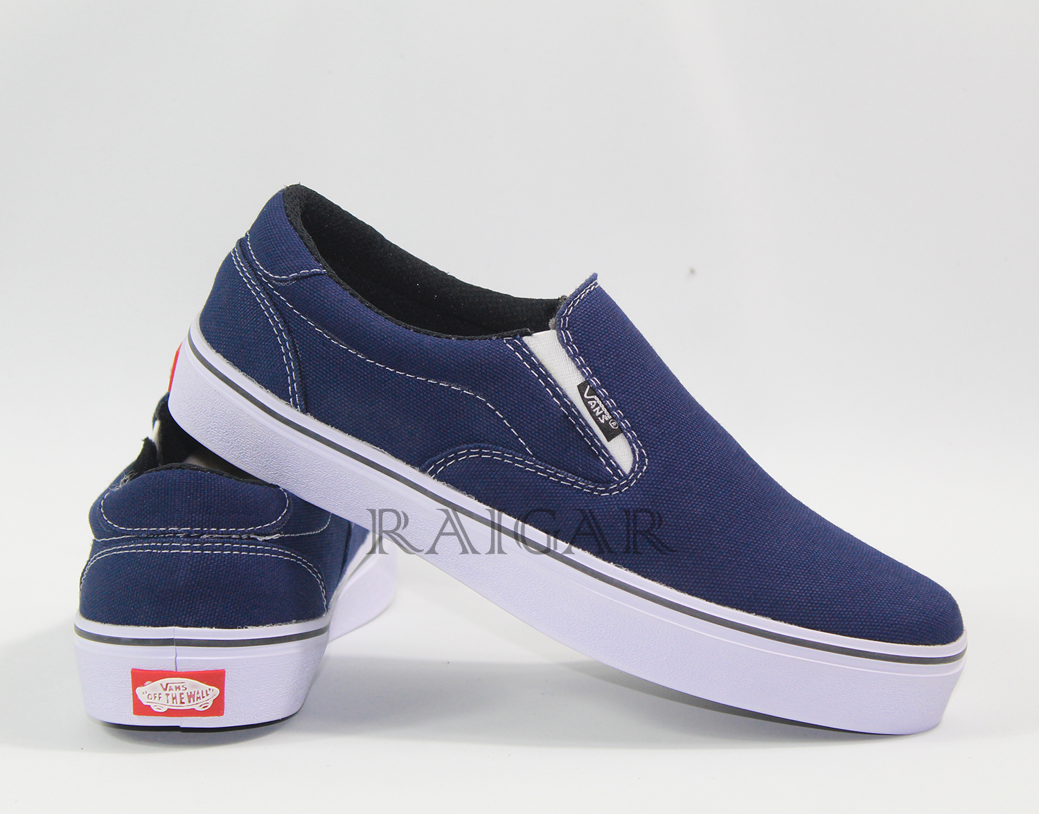 navy vans slip ons